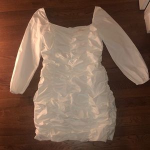 white cinched long sleeve dress